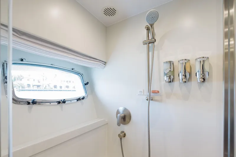 Slide: The Image of Luxurious shower area in 2016 Hargrave Flybridge Motor Yacht with modern fixtures and dispensers. - 30