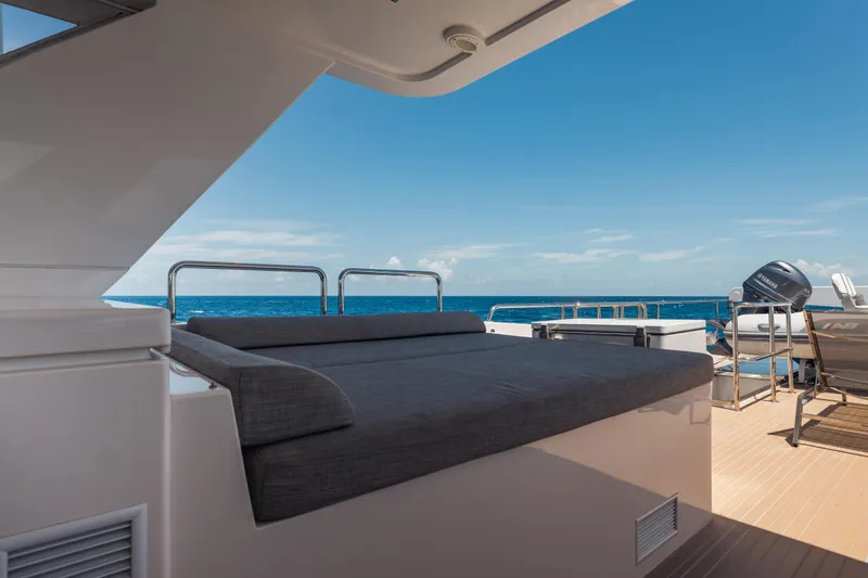 Slide: The Image of Luxurious 2016 Hargrave Flybridge Motor Yacht deck with ocean view and seating area. - 55