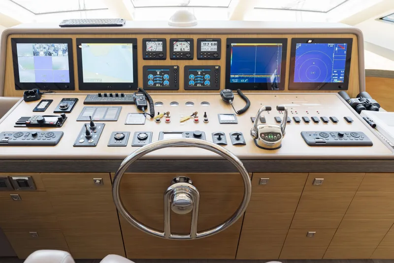 Slide: The Image of Control panel of a 2016 Hargrave Flybridge Motor Yacht with advanced navigation systems. - 17