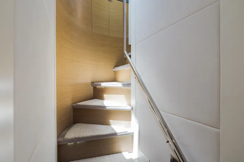 Slide: The Image of Staircase inside 2016 Hargrave Flybridge Motor Yacht, featuring sleek wood and modern design. - 23