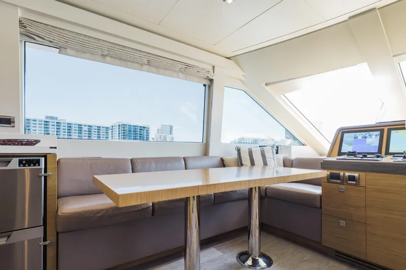 Slide: The Image of Luxurious interior of 2016 Hargrave Flybridge Motor Yacht with modern seating and panoramic windows. - 14