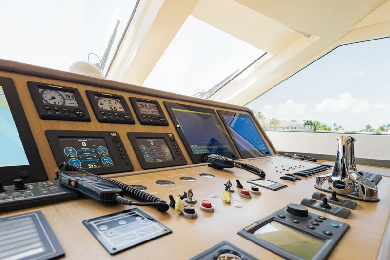 Slide: The Image of Control panel of a 2016 Hargrave Flybridge Motor Yacht, featuring advanced navigation instruments. - 19