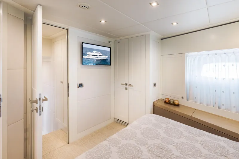 Slide: The Image of Luxurious bedroom interior of 2016 Hargrave Flybridge Motor Yacht with modern decor and TV. - 27