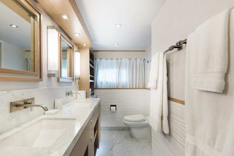 Slide: The Image of Luxurious bathroom in 2016 Hargrave Flybridge Motor Yacht with marble countertops and modern fixtures. - 45