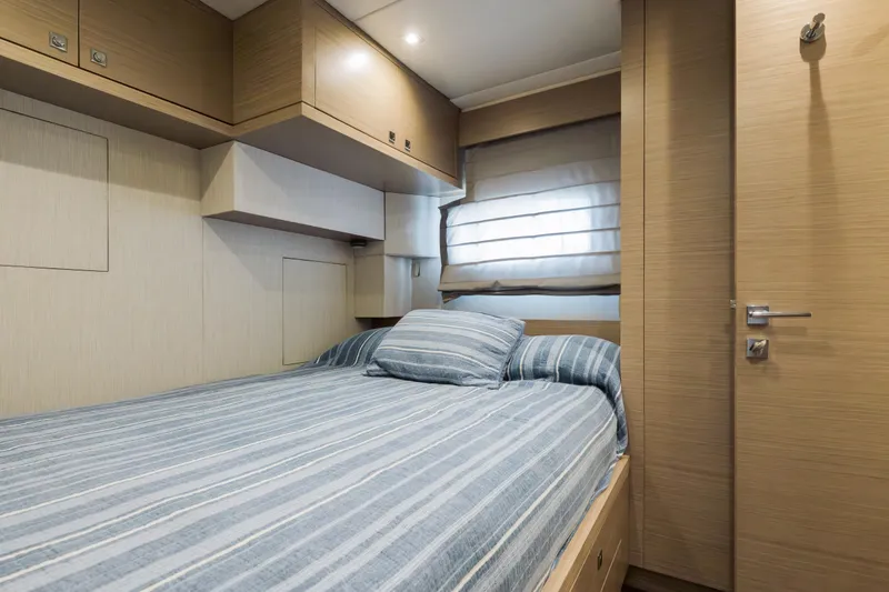Slide: The Image of Luxurious cabin interior of 2016 Hargrave Flybridge Motor Yacht with striped bedding. - 77