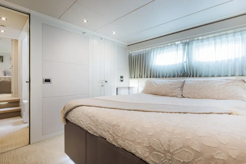 Slide: The Image of Luxurious bedroom interior of 2016 Hargrave Flybridge Motor Yacht with elegant bedding and soft lighting. - 32