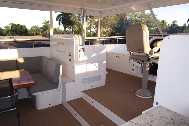 Slide: The Image of Luxurious 2016 Hargrave Flybridge Motor Yacht interior with seating and helm station. - 65