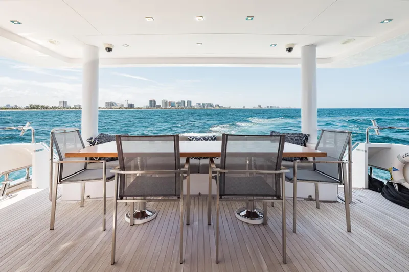 Slide: The Image of Luxurious 2016 Hargrave Flybridge Motor Yacht with ocean view and elegant outdoor seating. - 51