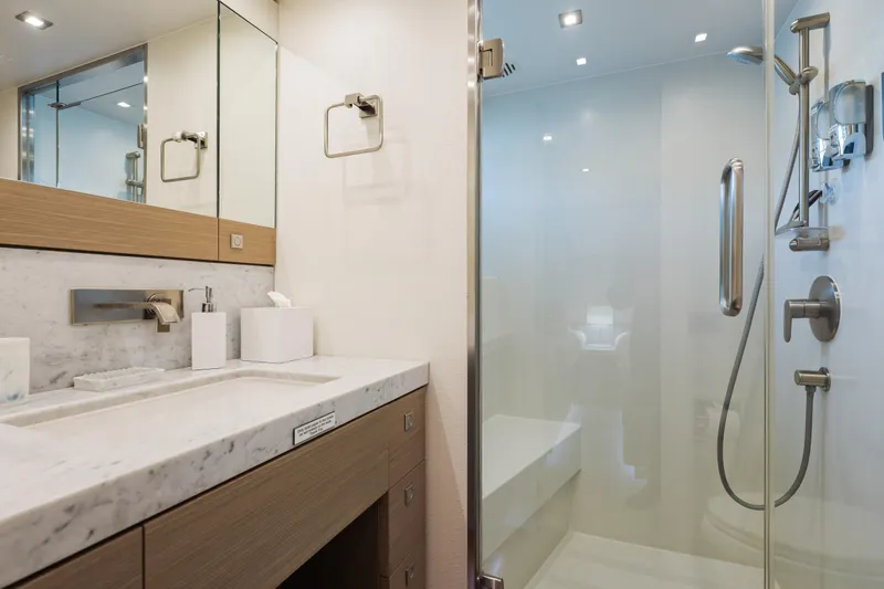 Slide: The Image of Luxurious bathroom in 2016 Hargrave Flybridge Motor Yacht with marble countertop and glass shower. - 38