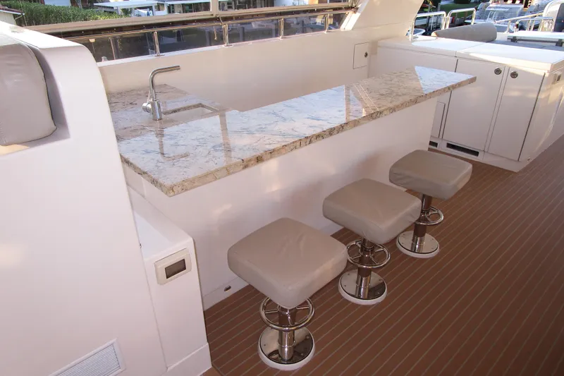 Slide: The Image of Luxurious 2016 Hargrave Flybridge Motor Yacht with elegant bar and seating area. - 58