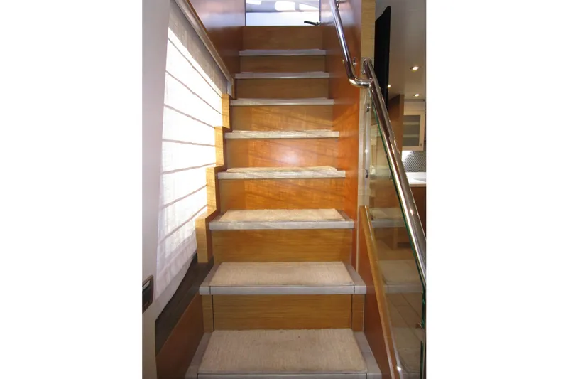 Slide: The Image of Staircase inside 2016 Hargrave Flybridge Motor Yacht with wooden steps and glass railing. - 22