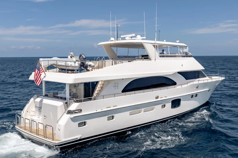 Slide: The Image of 2016 Hargrave Flybridge Motor Yacht cruising on open sea under clear skies. - 96
