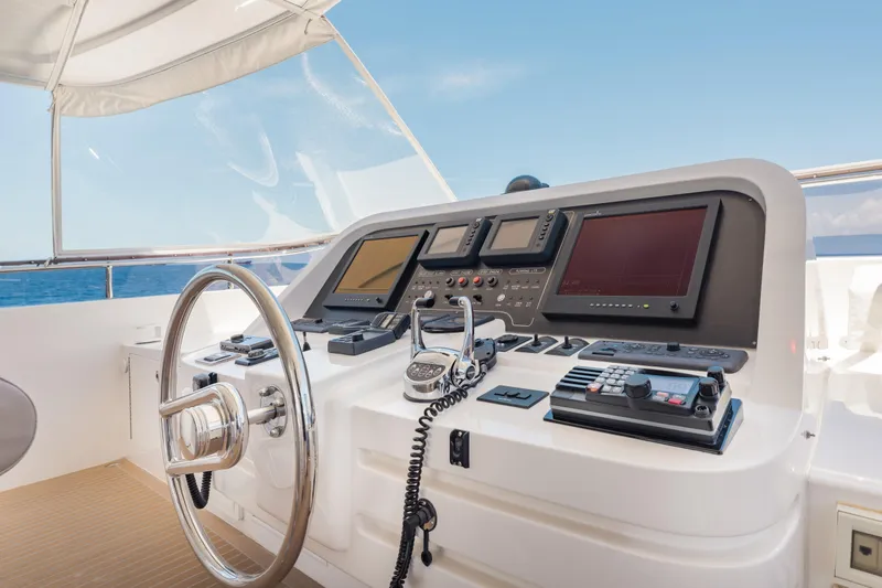 Slide: The Image of Helm of 2016 Hargrave Flybridge Motor Yacht with navigation controls and steering wheel. - 69