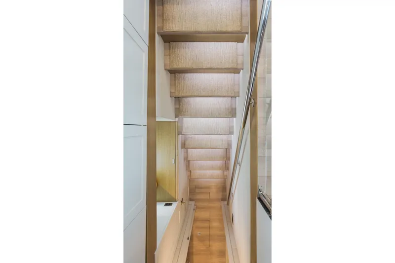 Slide: The Image of Staircase inside 2016 Hargrave Flybridge Motor Yacht, featuring modern design and wooden steps. - 39