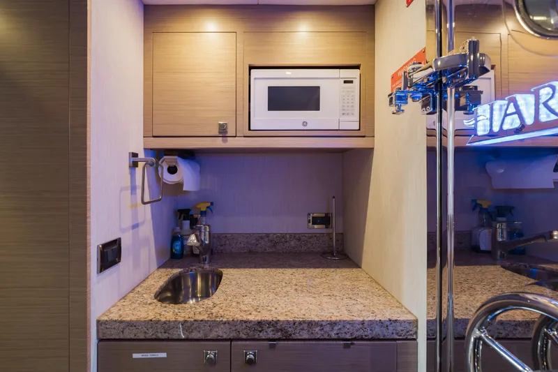 Slide: The Image of Compact kitchenette on 2016 Hargrave Flybridge Motor Yacht with microwave and granite countertop. - 75