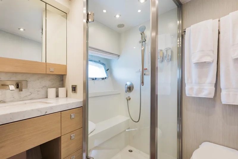 Slide: The Image of Luxurious bathroom on 2016 Hargrave Flybridge Motor Yacht with modern fixtures and elegant design. - 29
