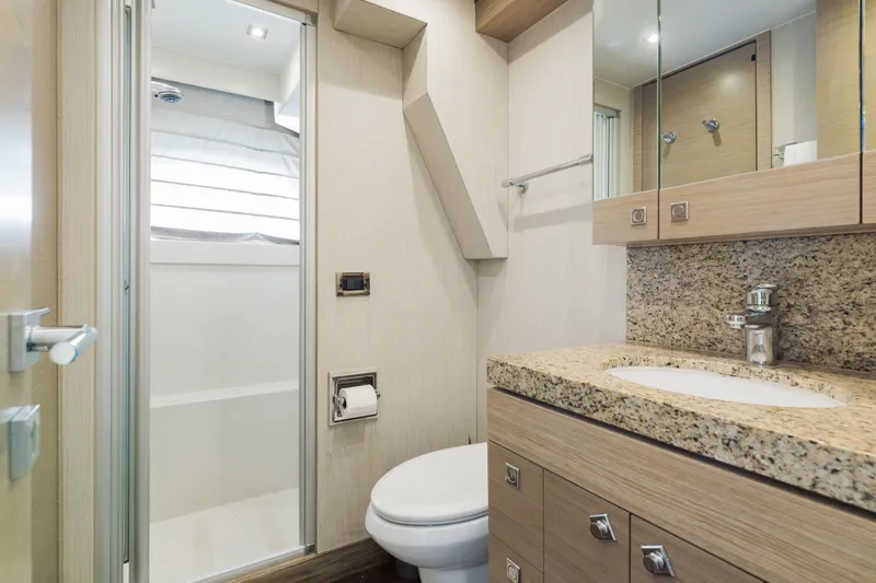 Slide: The Image of Luxurious bathroom in 2016 Hargrave Flybridge Motor Yacht with granite countertop and modern fixtures. - 81