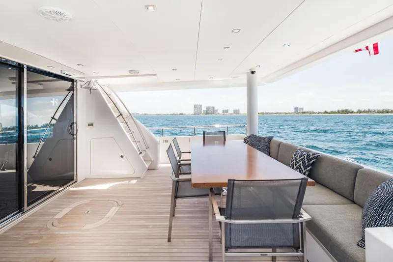 Slide: The Image of Luxurious 2016 Hargrave Flybridge Motor Yacht deck with seating and ocean view. - 49