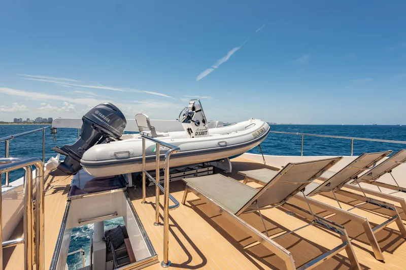 Slide: The Image of 2016 Hargrave Flybridge Motor Yacht with tender and sun loungers on deck, ocean view. - 70