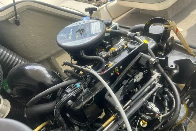 Slide: The Image of Engine of a 2011 Bayliner 185 Bowrider boat, showcasing intricate mechanical components. - 5