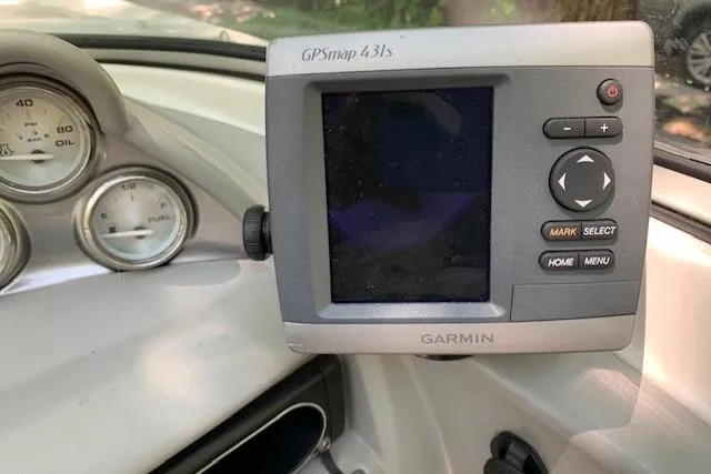 Slide: The Image of Garmin GPSmap 431s on 2011 Bayliner 185 Bowrider dashboard with gauges. - 11