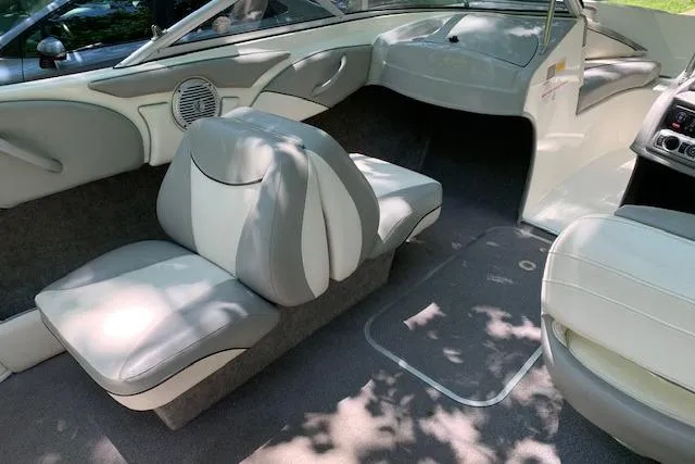 Slide: The Image of 2011 Bayliner 185 Bowrider interior with gray and white seating, showcasing modern design. - 12