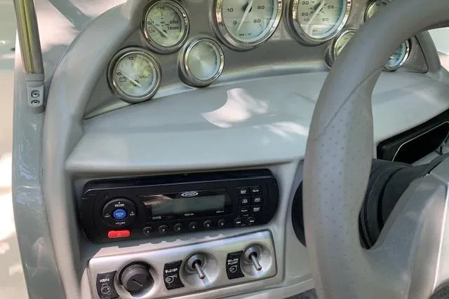Slide: The Image of Dashboard of a 2011 Bayliner 185 Bowrider with gauges and controls. - 10
