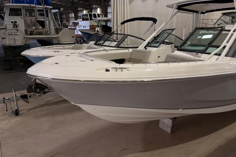 Slide: The Image of 2026 Boston Whaler 240 Vantage boat in a showroom, showcasing sleek design and modern features. - 3