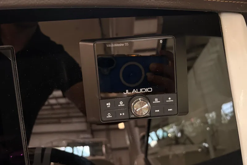 Slide: The Image of JL Audio MediaMaster 55 control panel on 2026 Boston Whaler 240 Vantage boat. - 16