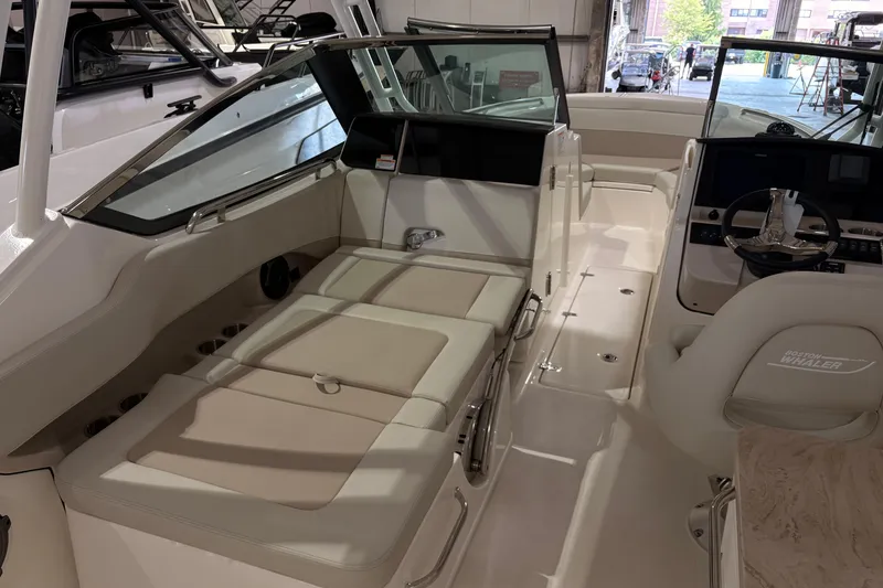 Slide: The Image of 2026 Boston Whaler 240 Vantage interior with luxurious seating and modern helm design. - 13