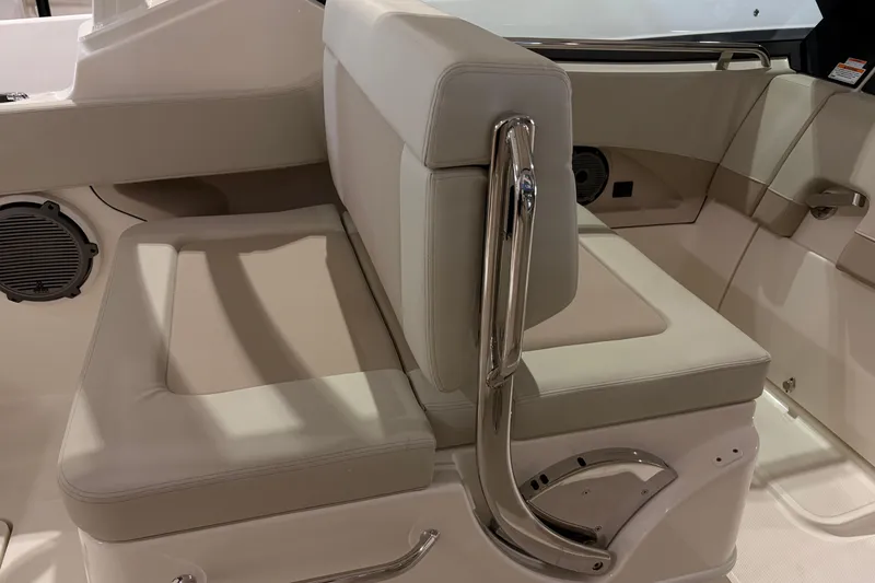 Slide: The Image of 2026 Boston Whaler 240 Vantage interior seating with beige upholstery and stainless steel accents. - 12