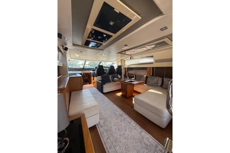Slide: The Image of Luxurious interior of 2012 Sunseeker Predator Sport Yacht 74, featuring elegant seating and modern design. - 13