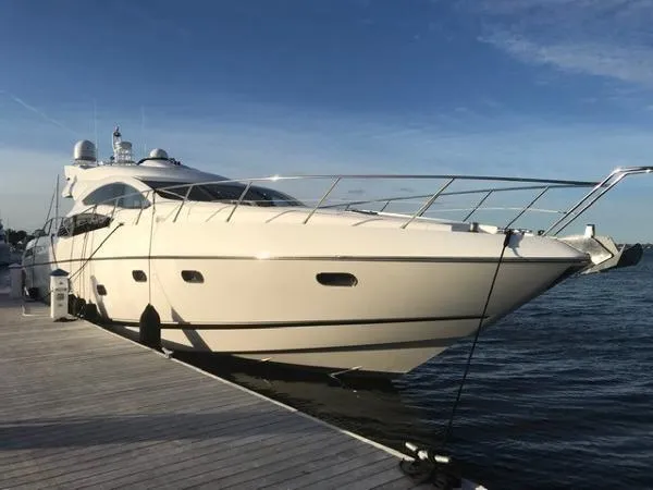 Slide: The Image of Sunseeker Predator Sport Yacht 74, 2012, docked at sunset. - 2