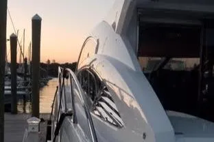 Slide: The Image of Sunseeker Predator Sport Yacht 74, 2012, docked at sunset. - 5