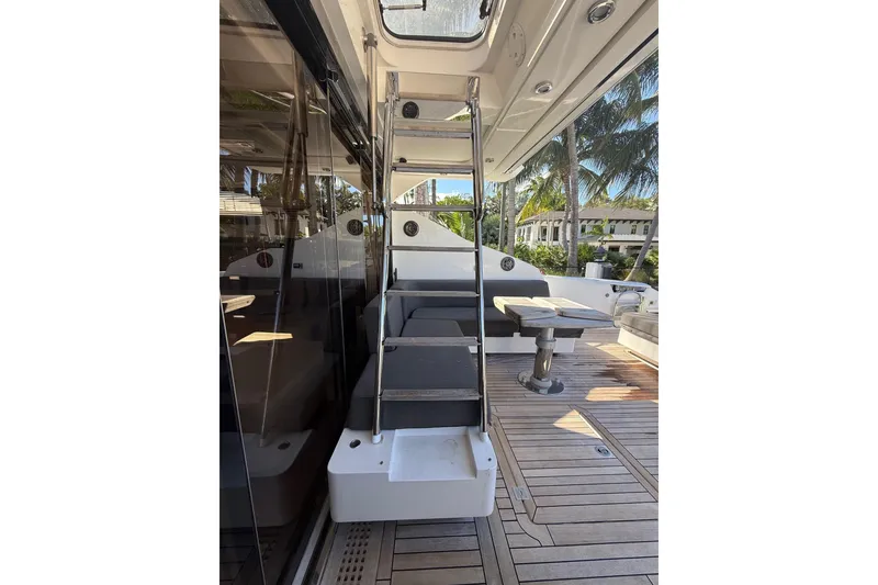 Slide: The Image of 2012 Sunseeker Predator Sport Yacht 74, featuring sleek deck and modern seating area. - 8