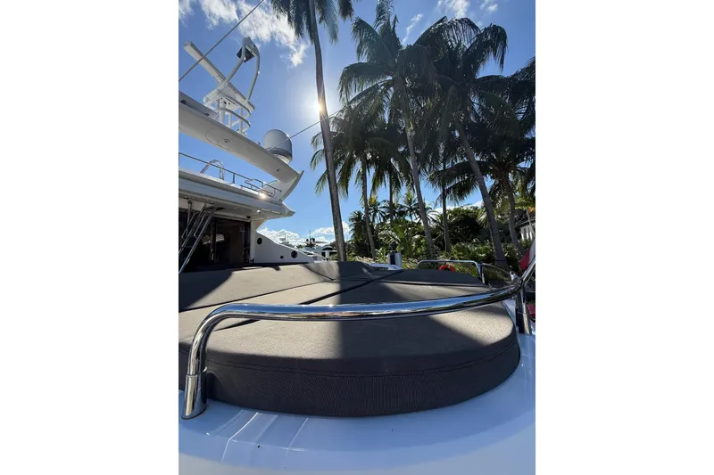 Slide: The Image of Sunseeker Predator Sport Yacht 74, 2012, with palm trees and clear sky background. - 11