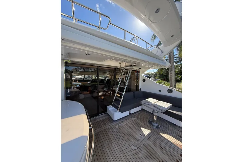 Slide: The Image of 2012 Sunseeker Predator Sport Yacht 74, outdoor seating area with sleek design and modern amenities. - 9