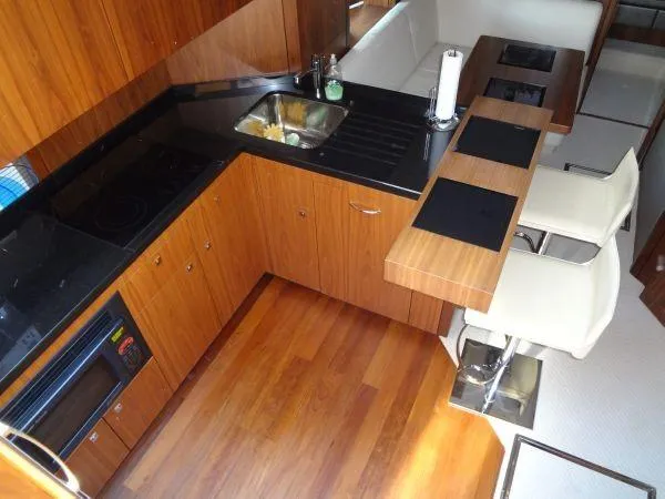 Slide: The Image of Interior of 2012 Sunseeker Predator Sport Yacht 74 with modern kitchen. - 21