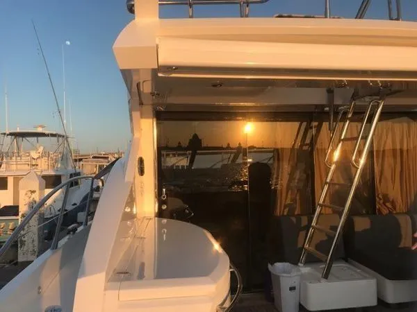 Slide: The Image of Sunseeker Predator Sport Yacht 74, 2012 model, docked at sunset. - 30
