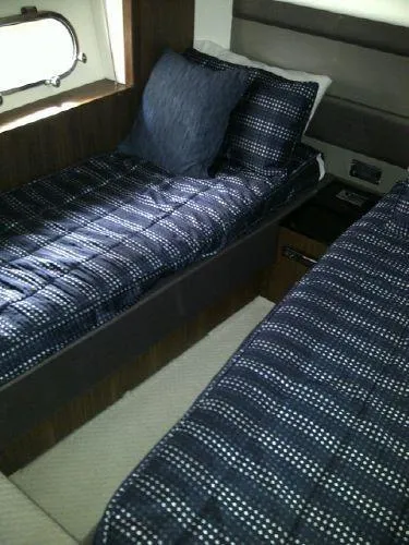 Slide: The Image of Interior of Sunseeker Predator Sport Yacht 74, 2012, featuring twin beds. - 28