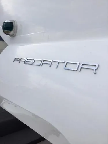 Slide: The Image of Sunseeker Predator Sport Yacht 74, 2012 model, emblem on white hull. - 29