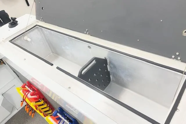 Slide: The Image of 2020 Hewescraft 240 Ocean Pro fishing boat storage compartment with organized tools. - 22