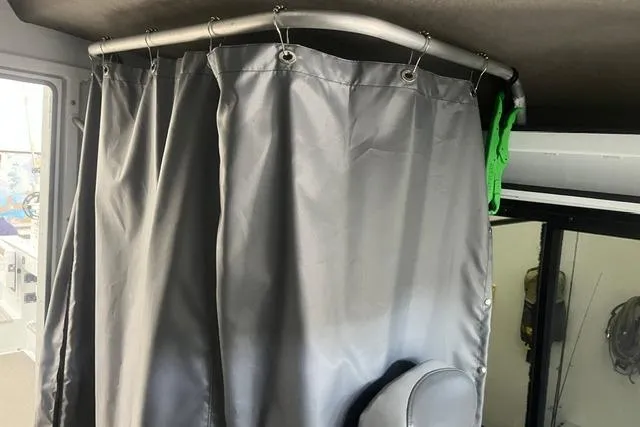 Slide: The Image of Gray privacy curtain inside 2020 Hewescraft 240 Ocean Pro boat cabin. - 14