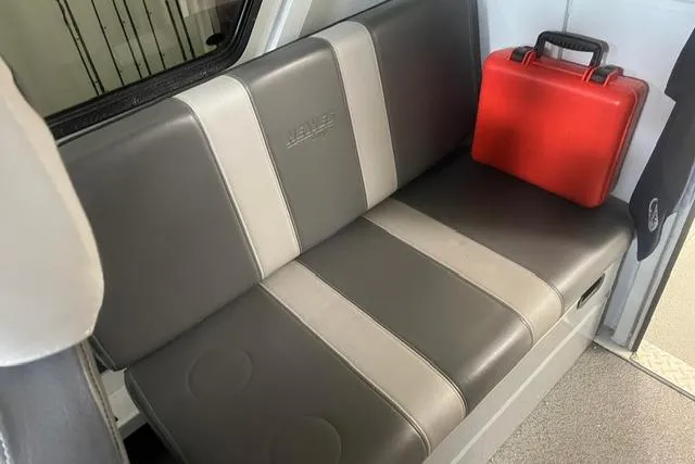 Slide: The Image of Interior of 2020 Hewescraft 240 Ocean Pro with gray seating and red case. - 13