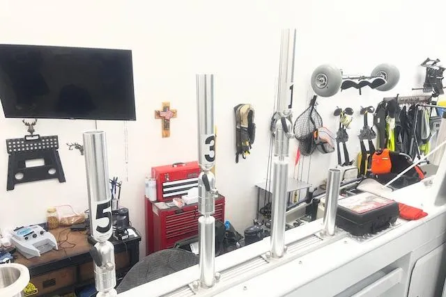 Slide: The Image of Workshop with fishing rod holders on a 2020 Hewescraft 240 Ocean Pro boat. - 8