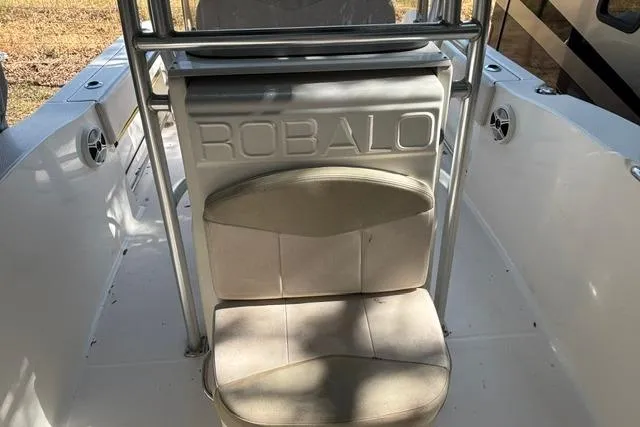 Slide: The Image of 2017 Robalo R200 Center Console boat interior with seating and speakers. - 8