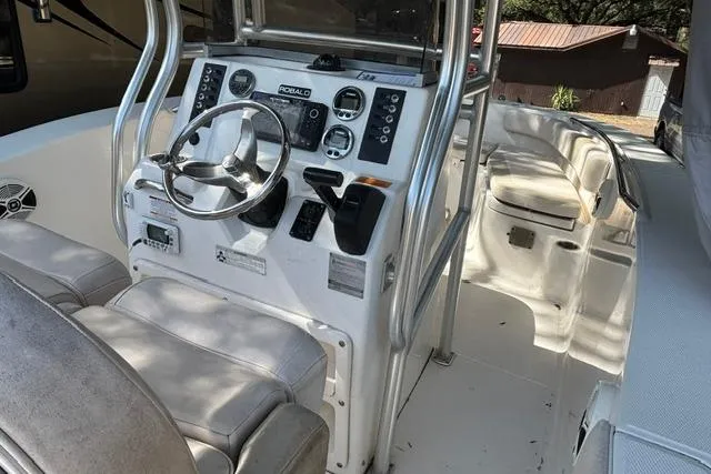 Slide: The Image of 2017 Robalo R200 Center Console boat interior with steering wheel and seating. - 9