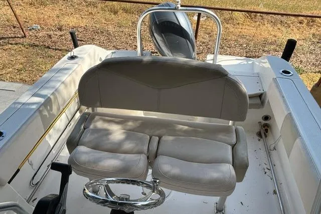 Slide: The Image of 2017 Robalo R200 Center Console boat interior with seating and steering wheel. - 6