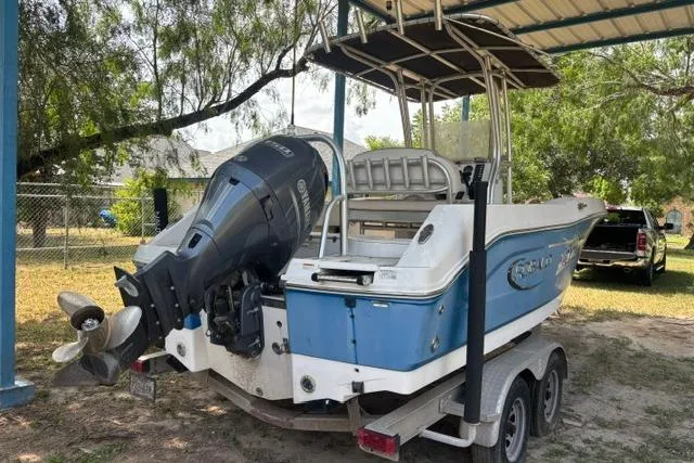 Slide: The Image of 2017 Robalo R200 Center Console boat on trailer, parked outdoors. - 3