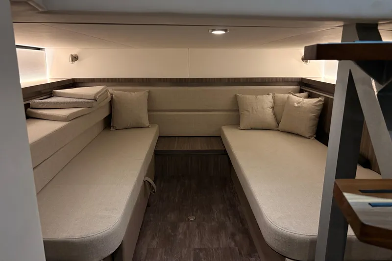 Slide: The Image of Interior cabin of 2027 Sea Ray Sundancer 320, featuring cozy seating and modern design. - 22